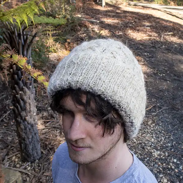 James is modelling a cable-knit beanie